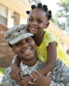 Army parent and their child celebrating a new home they just closed on due to the help of a VA Home Loan